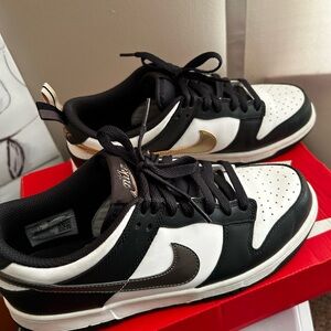 Nike Men's Black and White Sneakers with Gold Accents